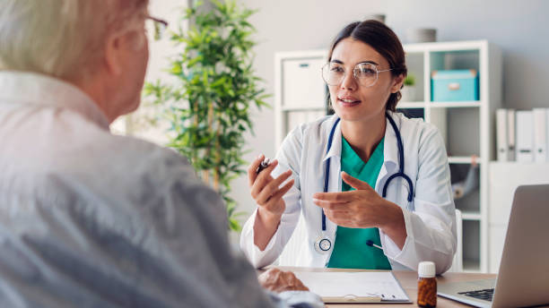 Doctor and patient are discussing at clinic Doctor and patient are discussing at clinic general practitioner photos stock pictures, royalty-free photos & images