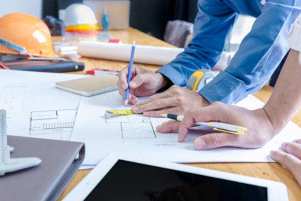 istock Team of engineers working together in a architect office. 1022804144
