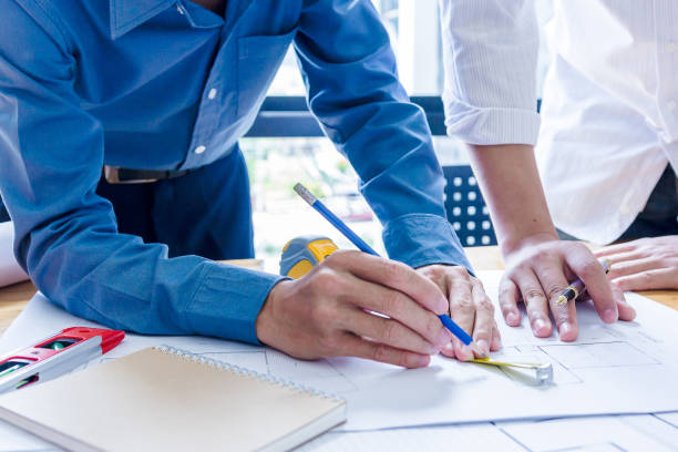 istock Team of engineers working together in a architect office. 1022804162
