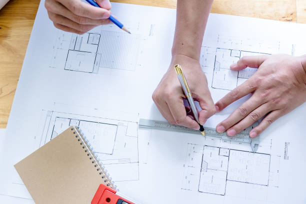 istock Team of engineers working together in a architect office. 1022804168