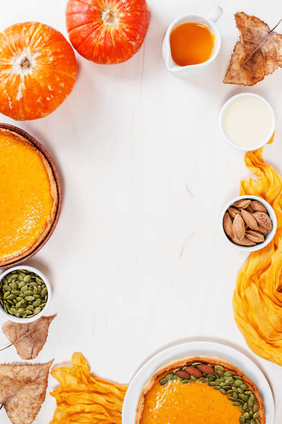 istock Background with fresh homemade pumpkin pies 1022804320