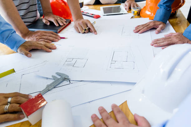 istock Team of engineers working together in a architect office. 1022804596