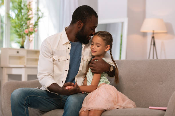 istock Joyful caring father hugging his child with love 1022805208
