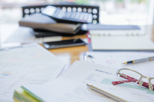 istock Fiinancial inspector making report, calculating or checking balance. 1022808738