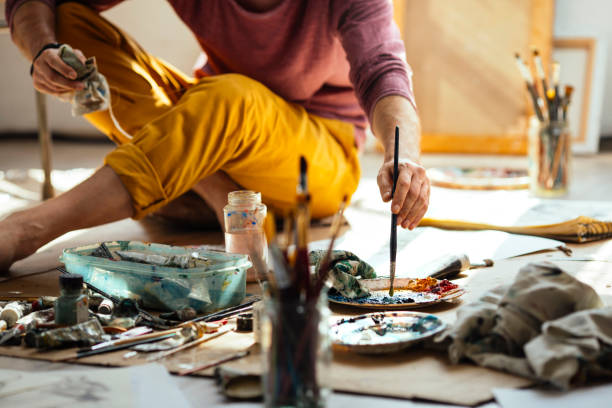 istock Male artist mixing paints 1022823392
