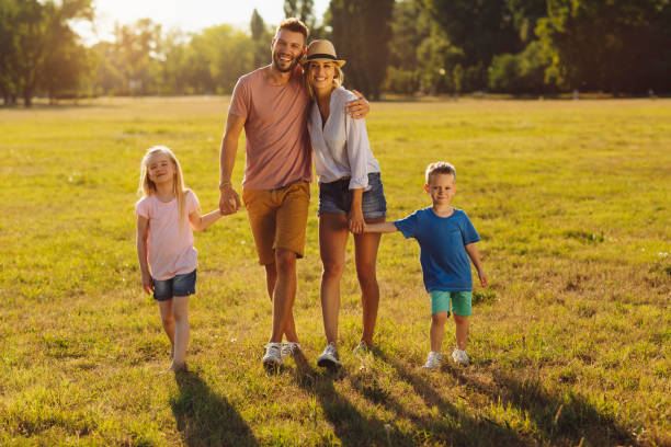 istock Family walking in the park 1022823612