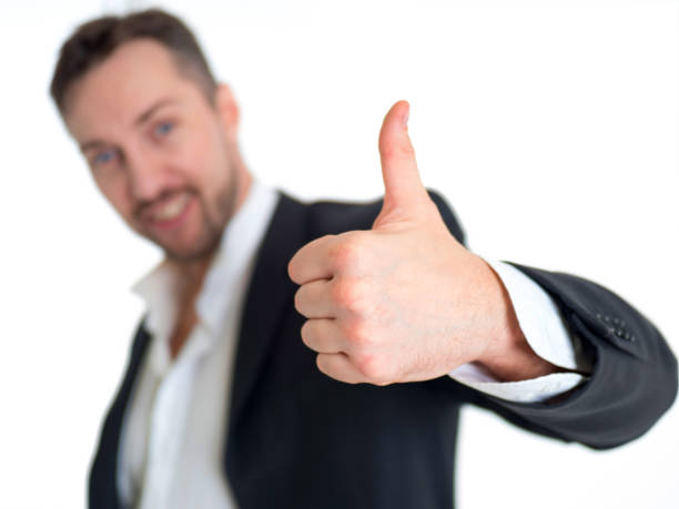 istock Smiling businessman with thumb up, isolated on white background 1022829062