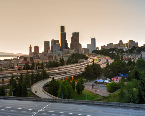 istock Seattle skylines and homeless tent with traffic at rush hour 1022833452