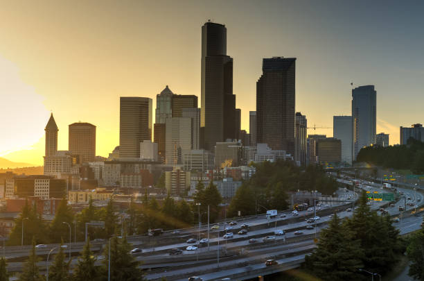 istock Seattle skylines and s-curved I-90, I-5 interchange during sunset 1022837754