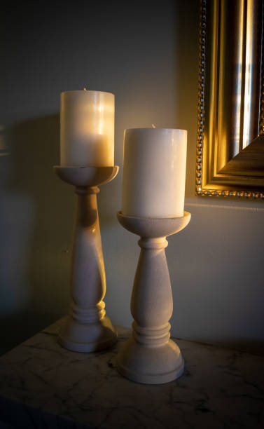 istock Candle Sticks on Marble Mantle by Gold Frame 1022837844