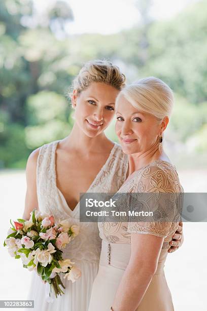 Mother And Bride Hugging Stock Photo - Download Image Now - Mother, Bride, Mother of the Bride