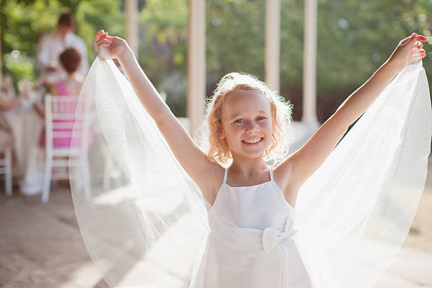 Flower girl with arms outstretched  flower girl stock pictures, royalty-free photos & images