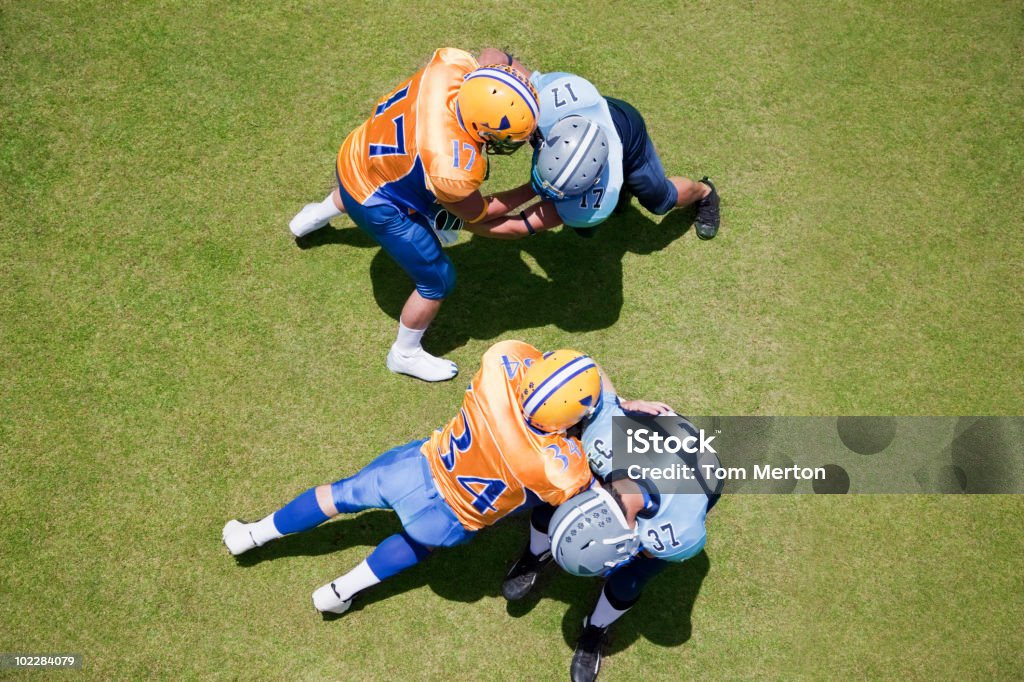 Football players playing football  American Football - Ball Stock Photo