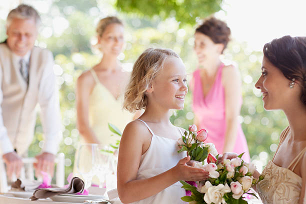 Family celebrating at wedding reception  flower girl stock pictures, royalty-free photos & images