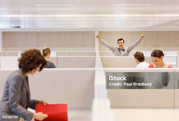 Businessman Cheering In Cubicle Stock Photo - Download Image Now - Office, Office Cubicle, Celebration