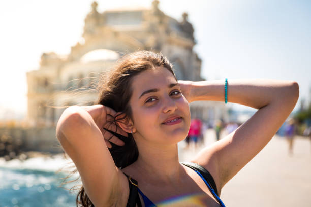 istock Happy smiling girl having fun in summer sun 1022841498