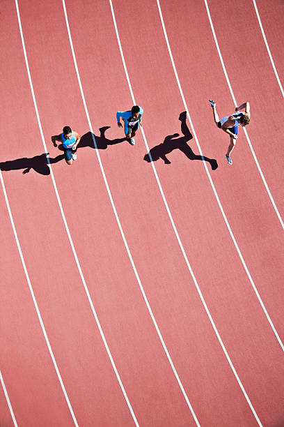 Runners competing on track  sports track photos stock pictures, royalty-free photos & images