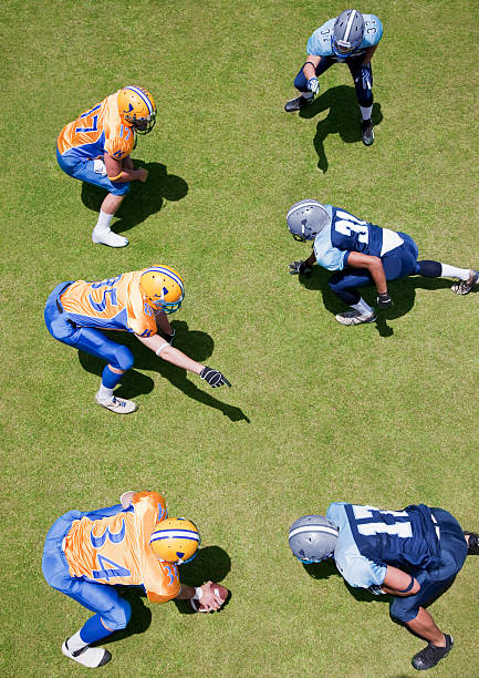 Football players playing football  offensive line stock pictures, royalty-free photos & images
