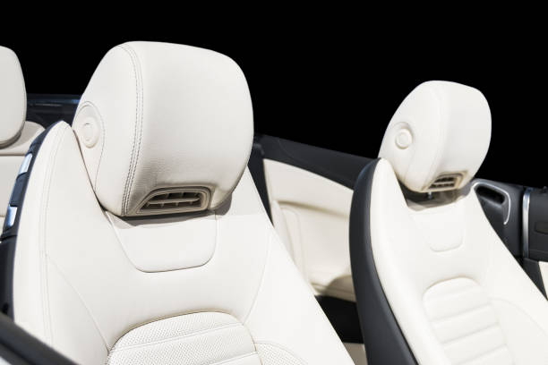 istock Car inside. Interior of a car. Comfortable leather white seats. white perforated leather. Car interior details. Car detailing 1022850260