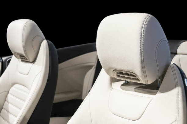 istock Car inside. Interior of a car. Comfortable leather white seats. white perforated leather. Car interior details. Car detailing 1022850916