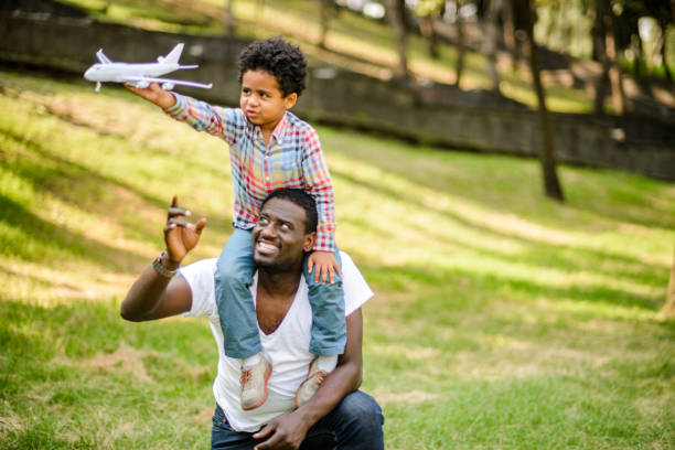 580 Black Father With Son On Shoulders Stock Photos Pictures 580-black-father-with-son-on-shoulders-stock-photos-pictures