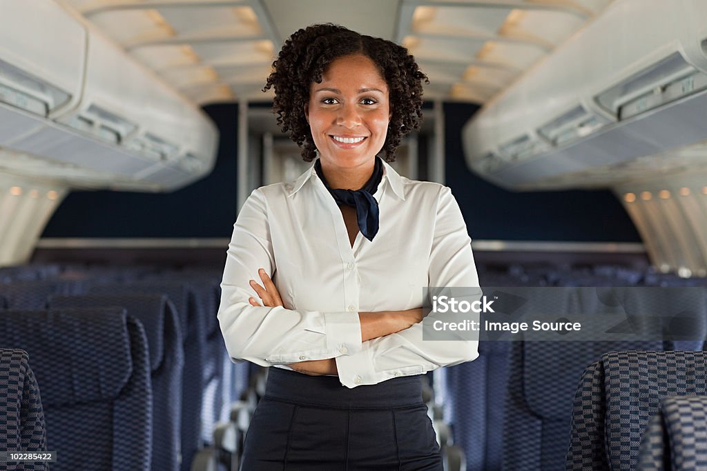 Stewardess on airplane  Cabin Crew Stock Photo