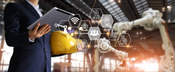 istock A futuristic architect, Businessman, Engineer manager using tablet with icon network, Industrial robotics, Automation robot arms machine in intelligent construction site. Construction technology concept 1022854988
