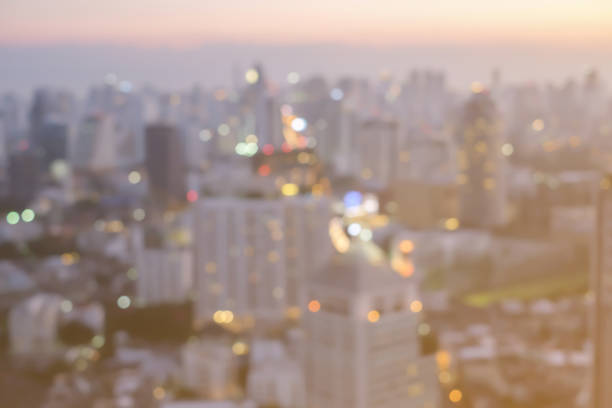 istock Blurred night city industrial background with bokeh flare light concept. 1022855470