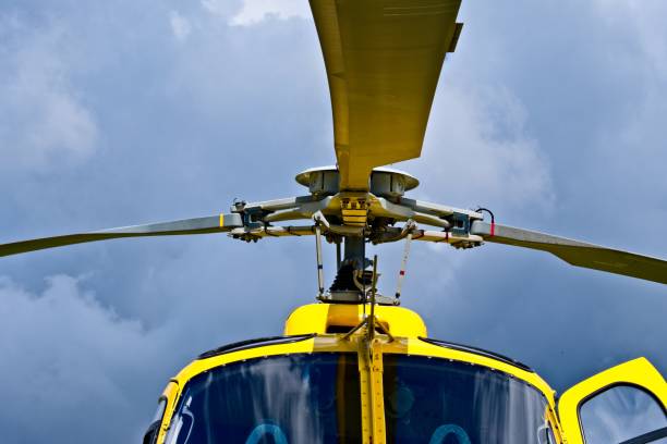 istock Yellow helicopter close up on the rotors 1022860968