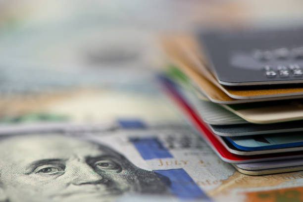 istock Stack of multicolored credit cards on banknotes 1022861202