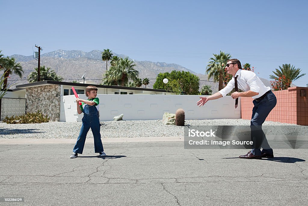 Father playing ball with son  Baseball - Sport Stock Photo