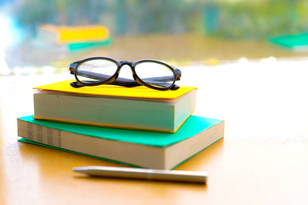 istock Eyeglasses on the pile of books 1022874302