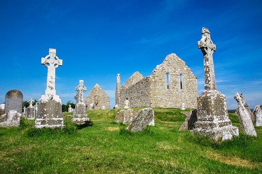 Clonmacnoise Cathedral  with the typical crosses and graves. The monastery ruins. Ireland