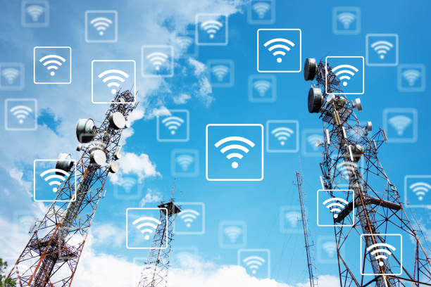 WiFi network on antennas on the top of a hill with blue sky background. stock photo