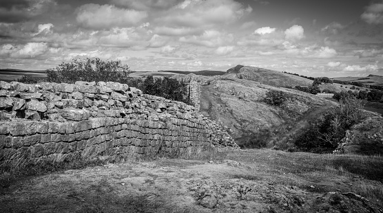 A black and withe photo of Hardien's wall, on the border of Scotland and England.
