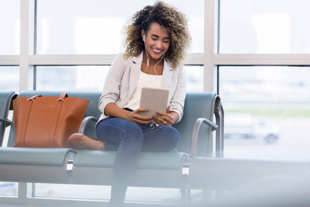 istock Woman uses digital tablet in airport 1022880280