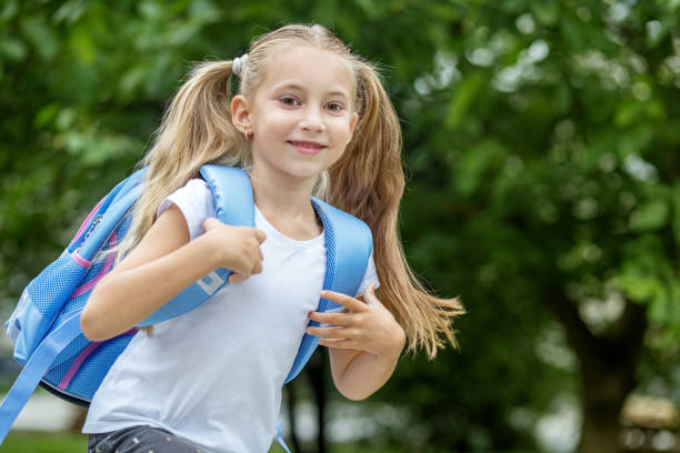 istock A little student is in a hurry to study with a backpack. The concept of school, study, education, friendship, childhood 1022885132