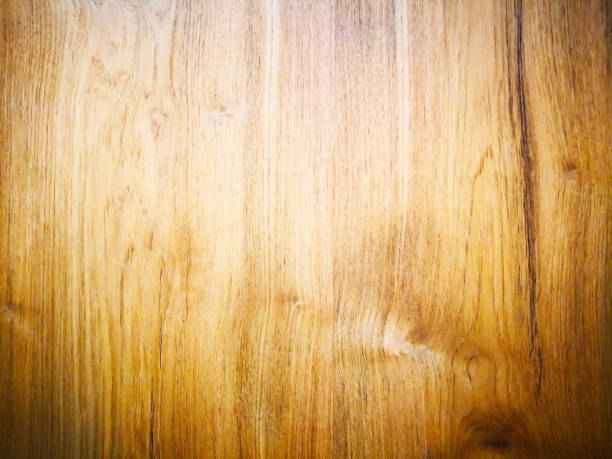 istock Home decoration concept and abstract background made with brown wood panel. Closeup view of brown wood panel. wood panel texture and background for wall design. Texture of smooth brown wood panel and copy space. 1022888084