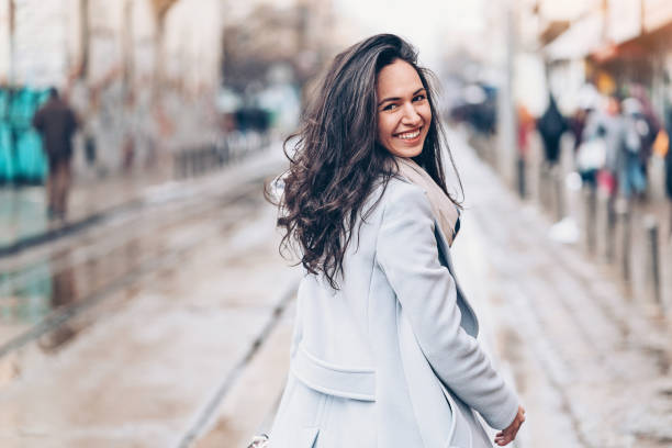 istock Beautiful young woman looking over her shoulder 1022889202