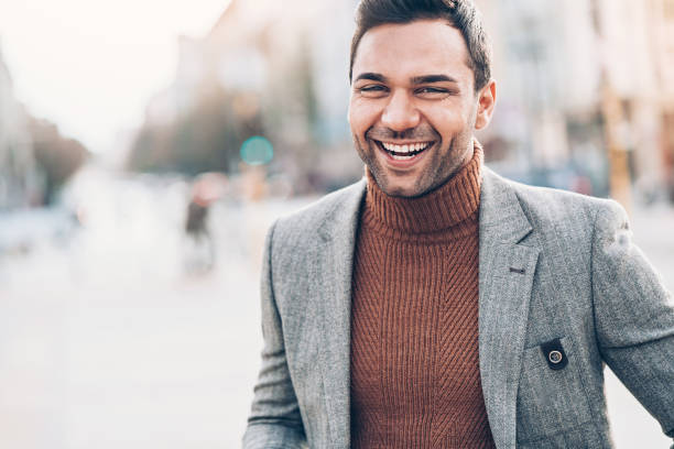 istock Cheerful well-dressed man outdoors 1022889210