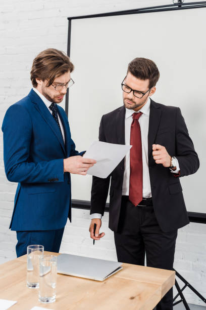 istock businessmen working with documents together at conference room 1022889624