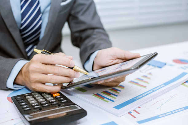 istock Business people using tablet at working with financial. 1022892320