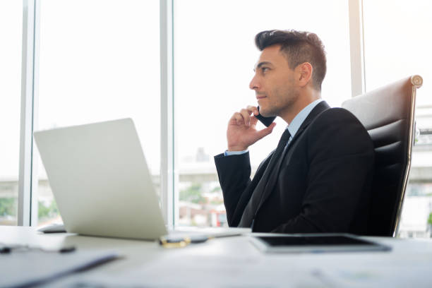 istock Concentrated Businessman is using cell phone. 1022898638