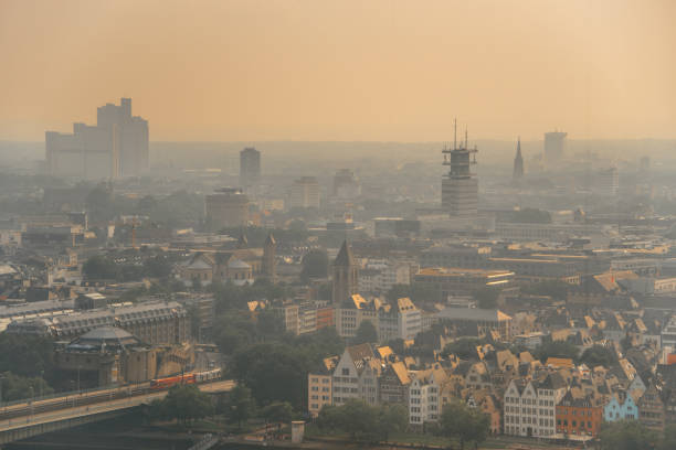 istock Foggy sunset over city 1022899472