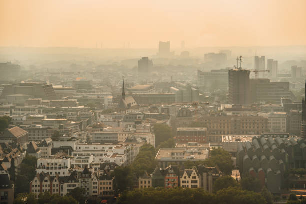 istock Foggy sunset over city 1022899534