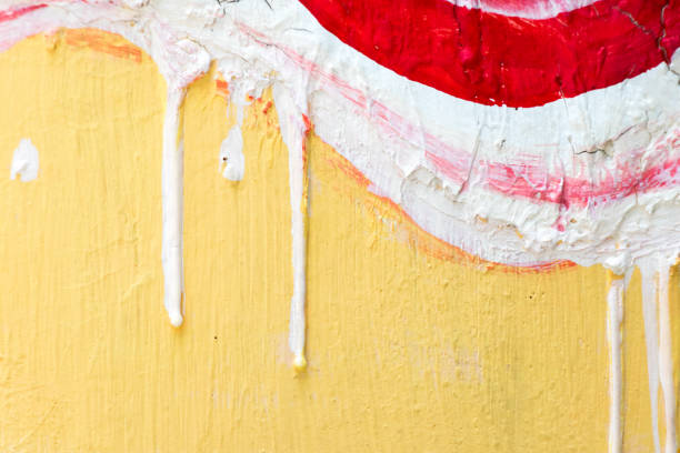 istock Abstract red, white and yellow painting on concrete background 1022901886