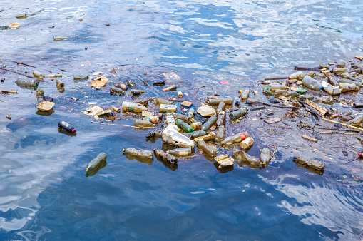 different Plastic waste floating in the sea