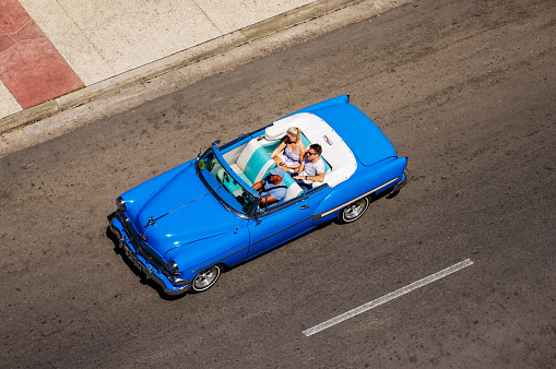 Havana. Cuba - july 31, 2018: top view taxi vintage classic cars in Old Havana streets with tourist, Cuba