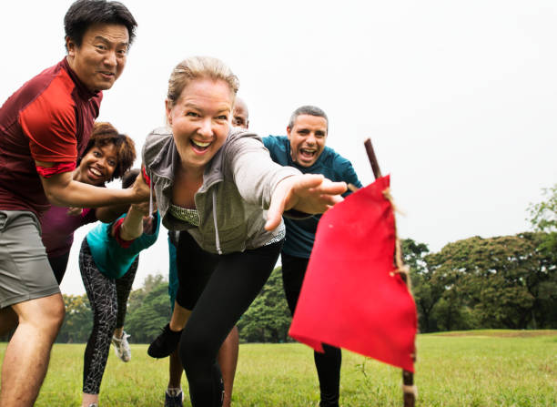 istock People racing to catch a flag 1022904952