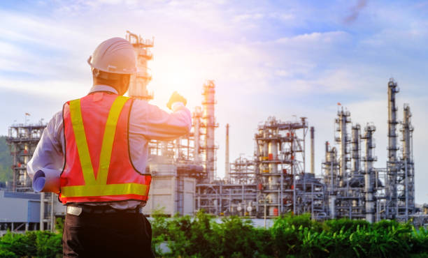 istock The engineer is standing on large industry background. 1022905434